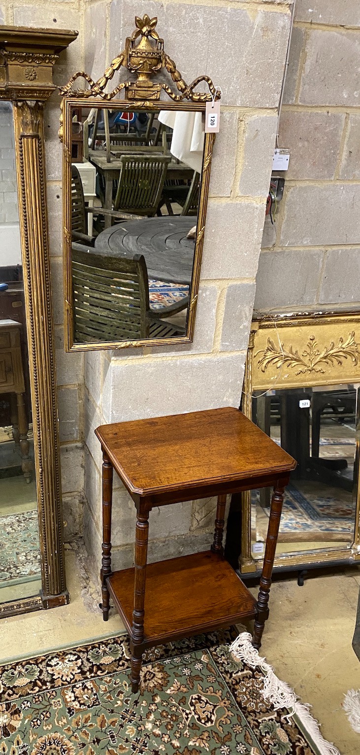 A George III style rectangular gilt framed wall mirror with vase surmount, width 39cm, height 80cm together with a late Victorian oak two tier occasional table